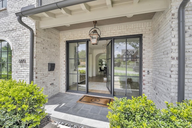 6819 Park Ln, Dallas, TX 75225 - view of exterior entry featuring brick siding