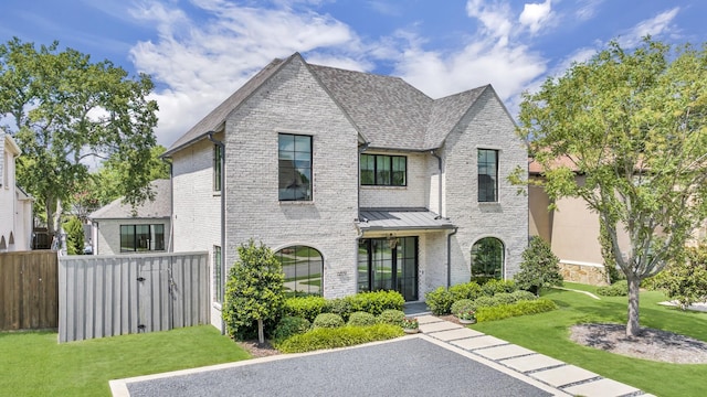 6819 Park Ln, Dallas, TX 75225 - french country home featuring brick siding