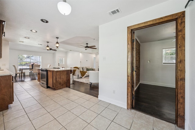 321 Malero Dr, Grand Prairie, TX 75051 - kitchen featuring a ceiling fan, stainless steel electric range oven, open floor plan, light tile patterned floors, and recessed lighting
