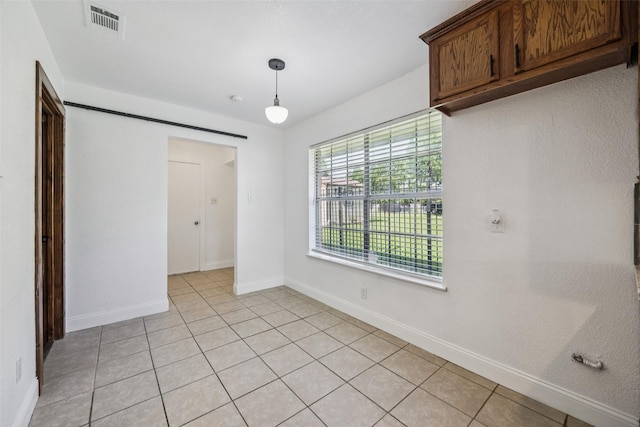 321 Malero Dr, Grand Prairie, TX 75051 - unfurnished dining area featuring baseboards and light tile patterned flooring