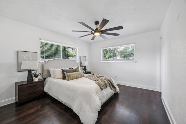 321 Malero Dr, Grand Prairie, TX 75051 - bedroom with dark wood finished floors, a textured ceiling, and a ceiling fan