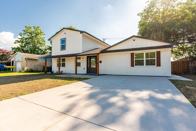 1105 Trellis Dr, Garland, TX 75040 - modern farmhouse featuring covered porch, board and batten siding, driveway, a shingled roof, and brick siding