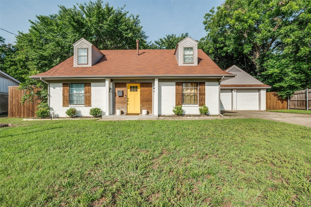 5921 Spring Glen Dr, Dallas, TX 75232 - cape cod-style house with driveway and brick siding