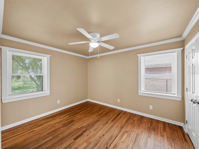 903 20th St, Plano, TX 75074 - empty room with wood finished floors, crown molding, and a ceiling fan