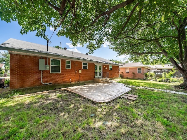 903 20th St, Plano, TX 75074 - rear view of property featuring a patio, brick siding, and a yard