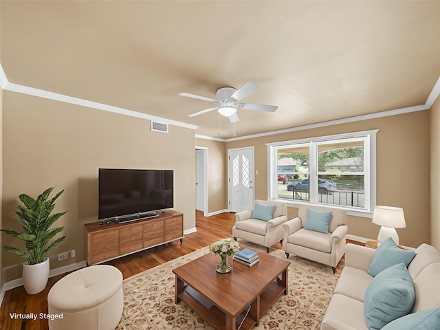 903 20th St, Plano, TX 75074 - living room featuring wood finished floors, ceiling fan, and crown molding
