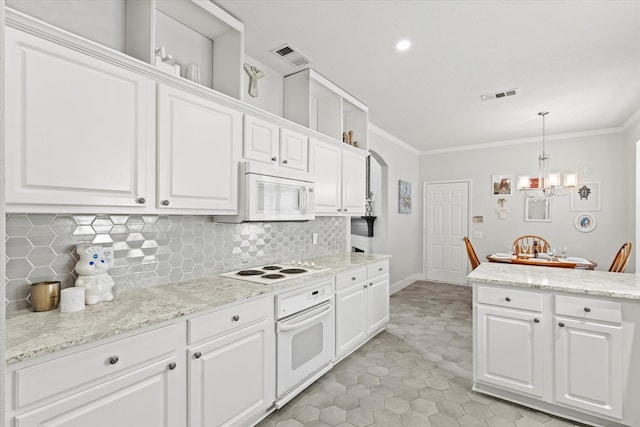 6749 Misty Hollow Dr, Plano, TX 75024 - kitchen featuring white appliances, ornamental molding, tasteful backsplash, and white cabinetry
