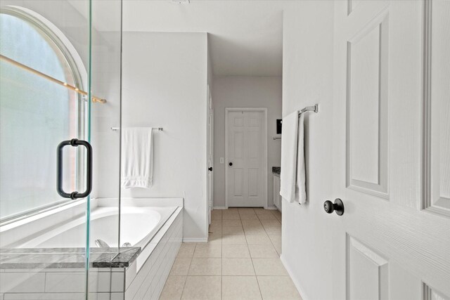 6749 Misty Hollow Dr, Plano, TX 75024 - full bath featuring a bath, tile patterned flooring, and a stall shower