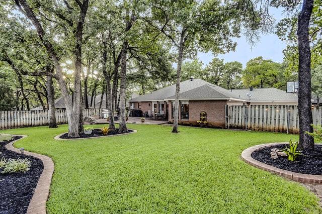 3008 Stone Bluff Ct, Arlington, TX 76017 - fenced backyard featuring a patio area