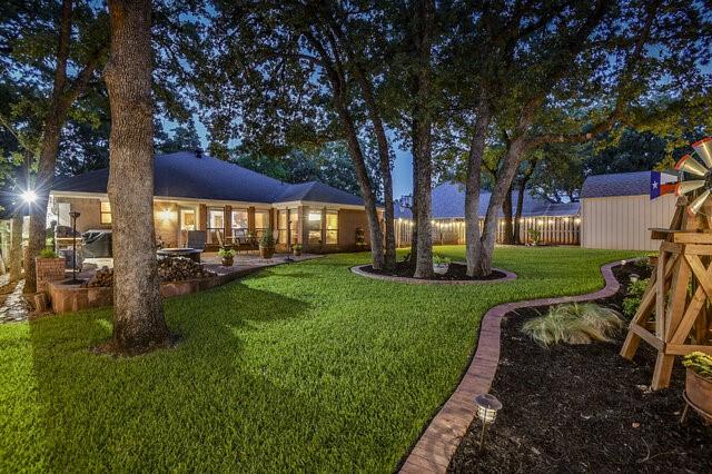 3008 Stone Bluff Ct, Arlington, TX 76017 - view of green lawn with a patio area