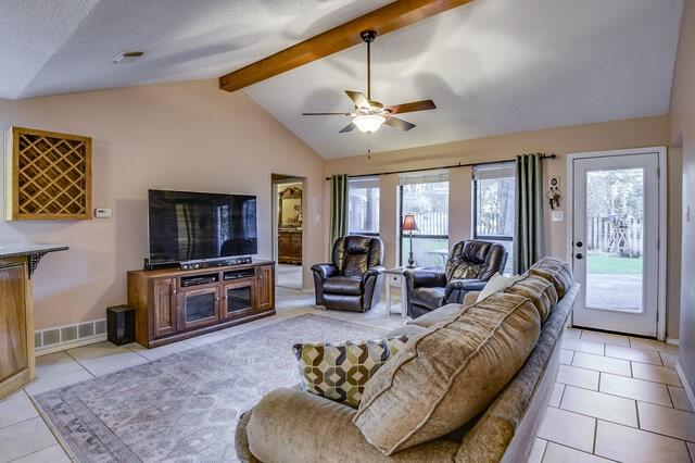 3008 Stone Bluff Ct, Arlington, TX 76017 - living room featuring light tile patterned floors and ceiling fan