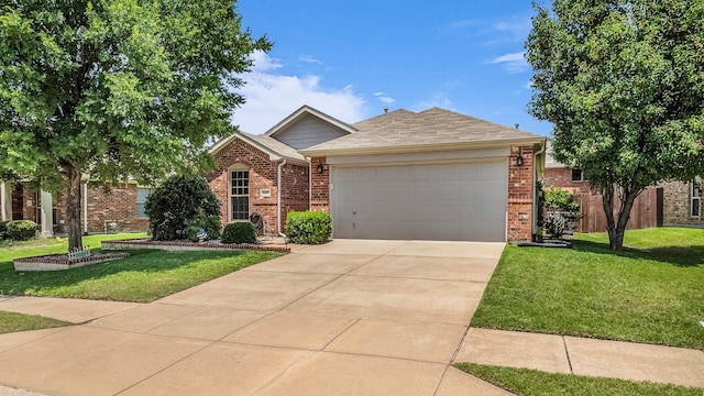 801 Lake Forest Trl, Little Elm, TX 75068 - view of front facade with brick siding, an attached garage, and a front yard