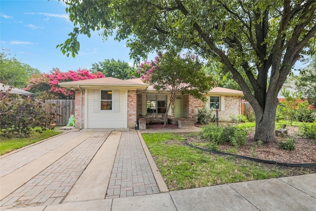 1714 O Pl, Plano, TX 75074 - single story home with brick siding and covered porch
