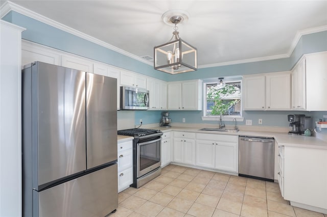 1714 O Pl, Plano, TX 75074 - kitchen featuring stainless steel appliances, a chandelier, light countertops, white cabinets, and ornamental molding