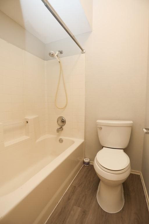 10606 Greenbriar Ln, Rowlett, TX 75089 - bathroom featuring wood finished floors and bathing tub / shower combination