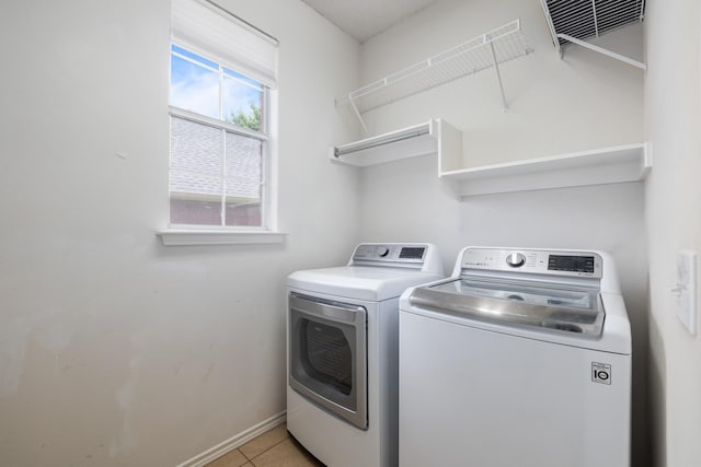 804 Wonder Way, Grapevine, TX 76051 - laundry area featuring washing machine and clothes dryer and light tile patterned floors
