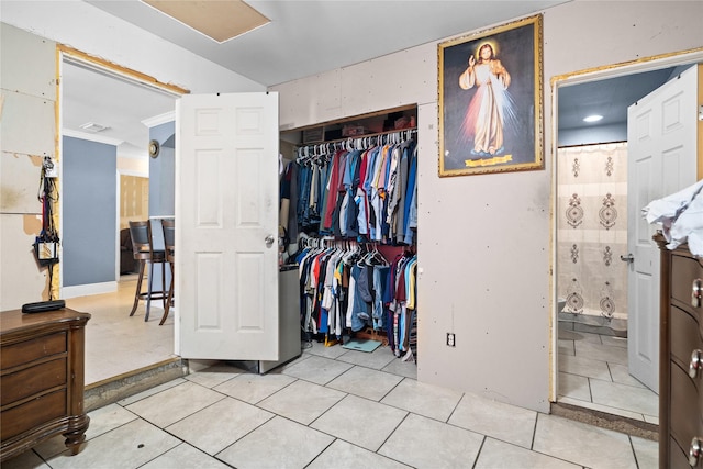1106 Melrose St, Garland, TX 75040 - bedroom featuring a closet, tile patterned flooring, and ensuite bathroom