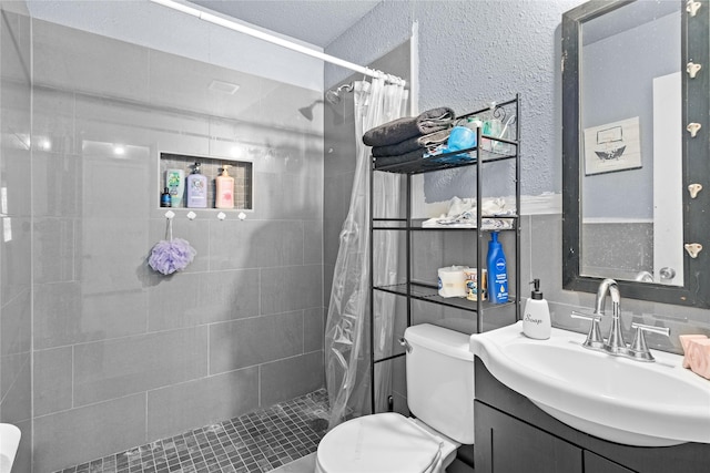 1106 Melrose St, Garland, TX 75040 - full bath featuring vanity, a tile shower, and a textured wall