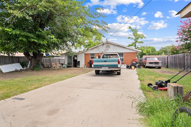 1106 Melrose St, Garland, TX 75040 - view of front facade with driveway and brick siding