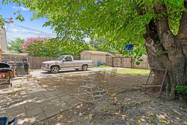 1106 Melrose St, Garland, TX 75040 - fenced backyard featuring a storage unit