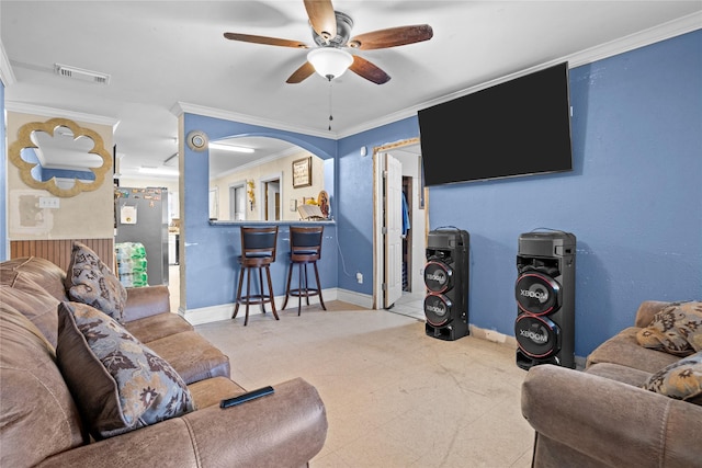 1106 Melrose St, Garland, TX 75040 - living room featuring ornamental molding, ceiling fan, and arched walkways