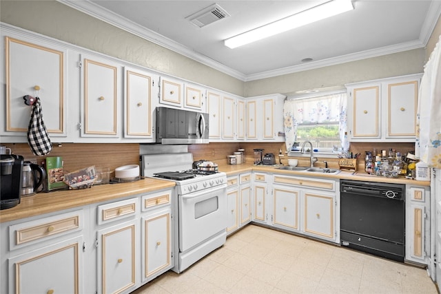 1106 Melrose St, Garland, TX 75040 - kitchen featuring white gas range, dishwasher, stainless steel microwave, light countertops, and crown molding