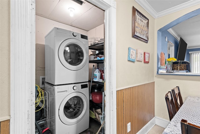 1106 Melrose St, Garland, TX 75040 - laundry room with estacked washer and dryer, ornamental molding, wainscoting, and wooden walls