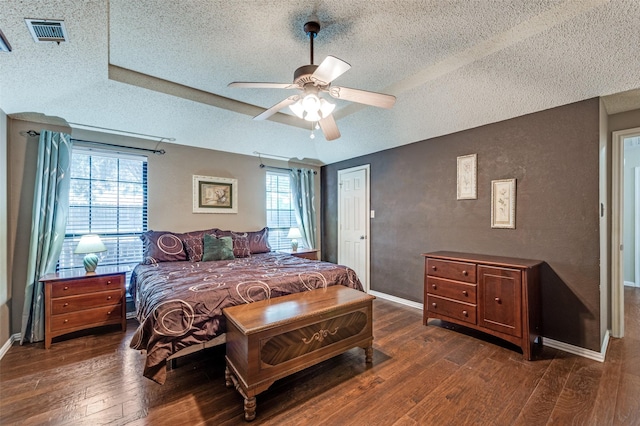 234 Raintree Dr, Highland Village, TX 75077 - bedroom featuring a textured ceiling, wood-type flooring, and a ceiling fan