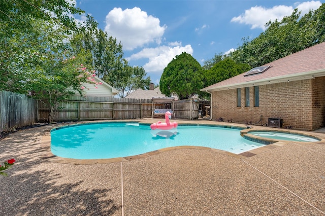 234 Raintree Dr, Highland Village, TX 75077 - view of pool with a fenced backyard, a patio, and a pool with connected hot tub