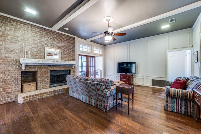 234 Raintree Dr, Highland Village, TX 75077 - living room featuring a decorative wall, a ceiling fan, wood finished floors, and a brick fireplace