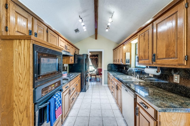 234 Raintree Dr, Highland Village, TX 75077 - kitchen with black appliances, lofted ceiling, light tile patterned floors, brown cabinetry, and under cabinet range hood