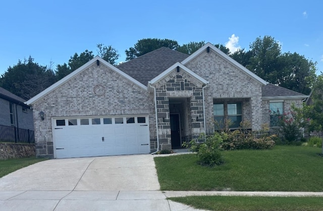 1604 Ironwood Way, Melissa, TX 75454 - view of front of property with an attached garage, a front yard, driveway, stone siding, and roof with shingles