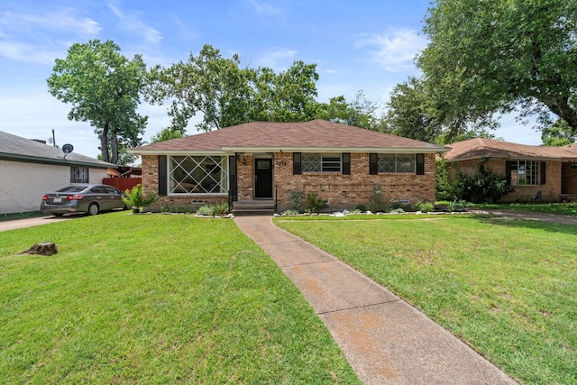 9239 Jennie Lee Ln, Dallas, TX 75227 - single story home featuring brick siding, a front lawn, and crawl space