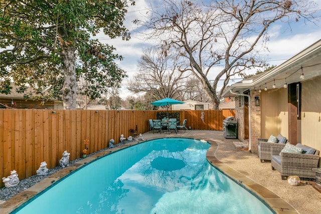 205 N Weatherred Dr, Richardson, TX 75080 - view of pool featuring a fenced backyard, area for grilling, a patio, and outdoor dining space