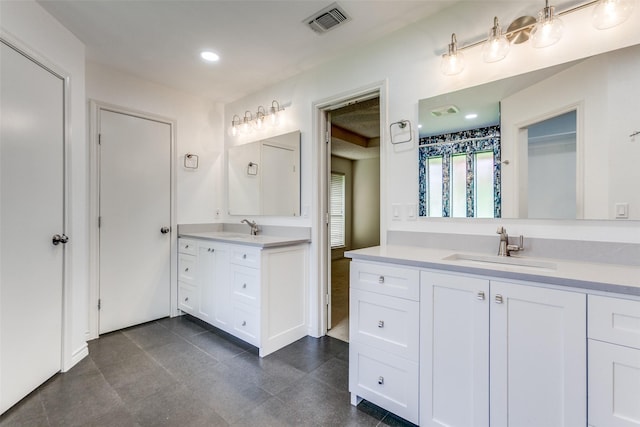 2307 Silver Holly Ln, Richardson, TX 75082 - full bathroom with two vanities and recessed lighting