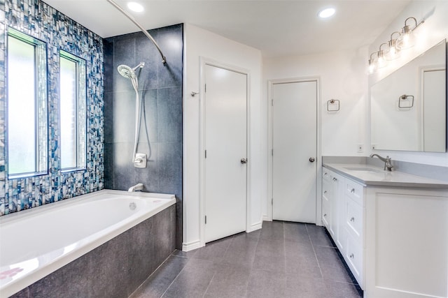2307 Silver Holly Ln, Richardson, TX 75082 - bathroom with a tub, vanity, tile patterned flooring, a tile shower, and recessed lighting