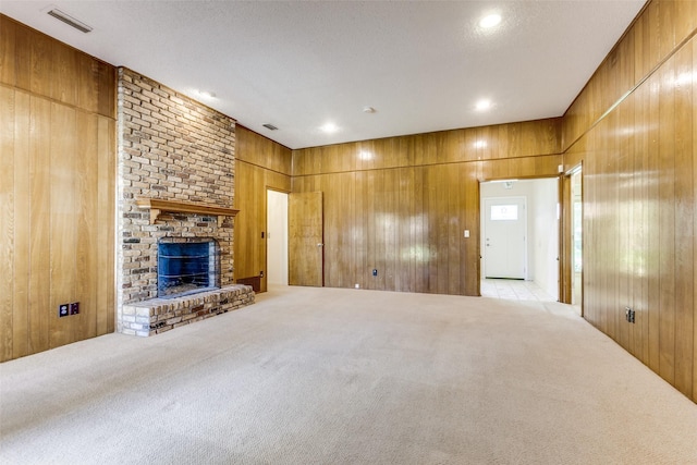 2307 Silver Holly Ln, Richardson, TX 75082 - unfurnished living room with carpet, wooden walls, and a fireplace