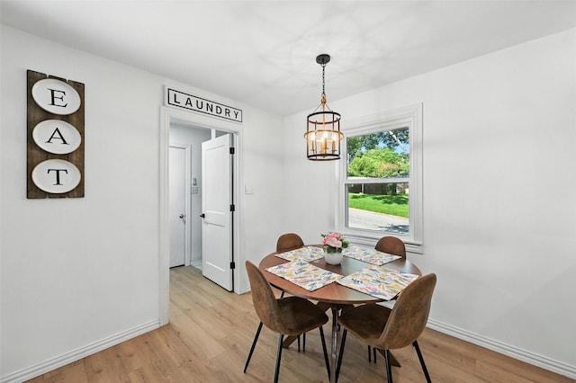 336 Davis Dr, Desoto, TX 75115 - dining area featuring a chandelier and light wood-style flooring