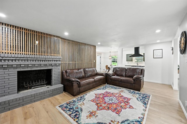 336 Davis Dr, Desoto, TX 75115 - living room featuring wood finished floors, recessed lighting, and a fireplace