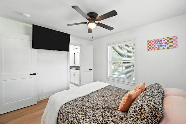 336 Davis Dr, Desoto, TX 75115 - bedroom featuring light wood finished floors, ceiling fan, and connected bathroom