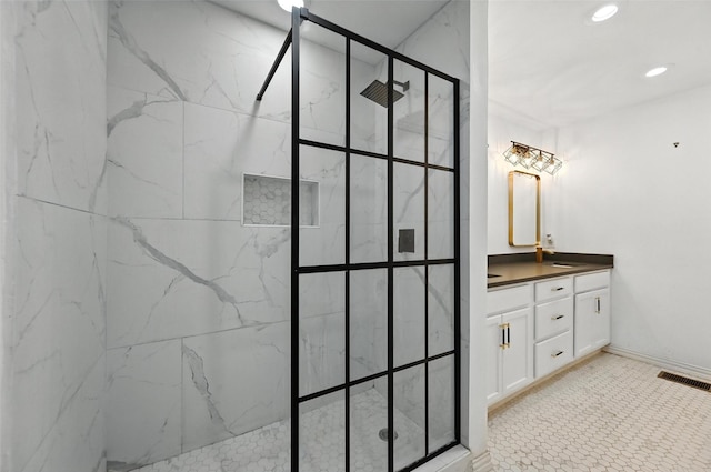 336 Davis Dr, Desoto, TX 75115 - bathroom with double vanity, a marble finish shower, and recessed lighting