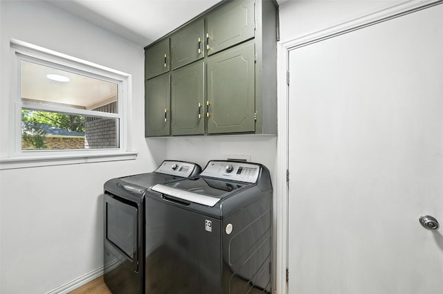 336 Davis Dr, Desoto, TX 75115 - laundry room featuring cabinet space and washing machine and dryer