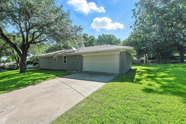 336 Davis Dr, Desoto, TX 75115 - view of side of home featuring an attached garage, a yard, and driveway