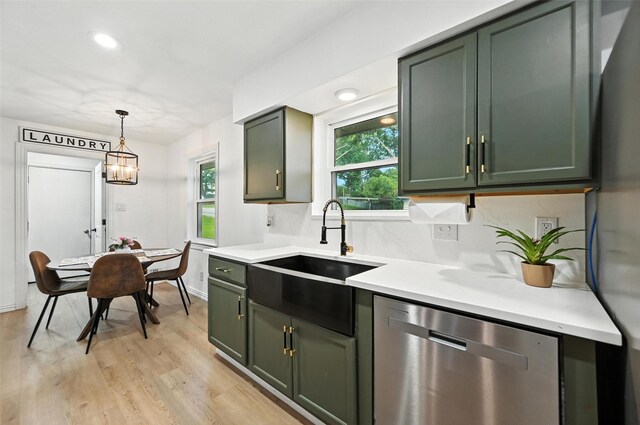 336 Davis Dr, Desoto, TX 75115 - kitchen with green cabinets, stainless steel dishwasher, light countertops, light wood-style floors, and recessed lighting