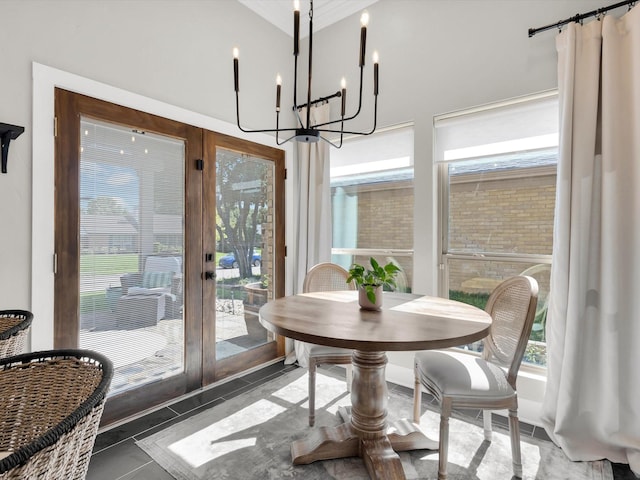 3813 Fall Wheat Dr, Plano, TX 75075 - tiled dining space with french doors, a chandelier, plenty of natural light, and a high ceiling