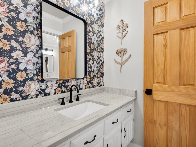 3813 Fall Wheat Dr, Plano, TX 75075 - bathroom with ornamental molding, wallpapered walls, and vanity