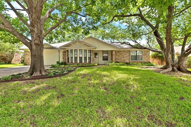 7254 Hialeah Cir W, North Richland Hills, TX 76182 - ranch-style house featuring brick siding, an attached garage, asphalt driveway, and a front yard