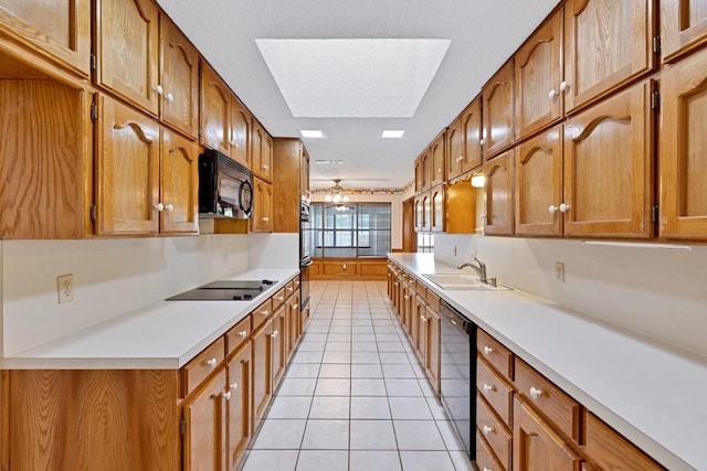7254 Hialeah Cir W, North Richland Hills, TX 76182 - kitchen featuring black appliances, light tile patterned flooring, brown cabinets, and light countertops