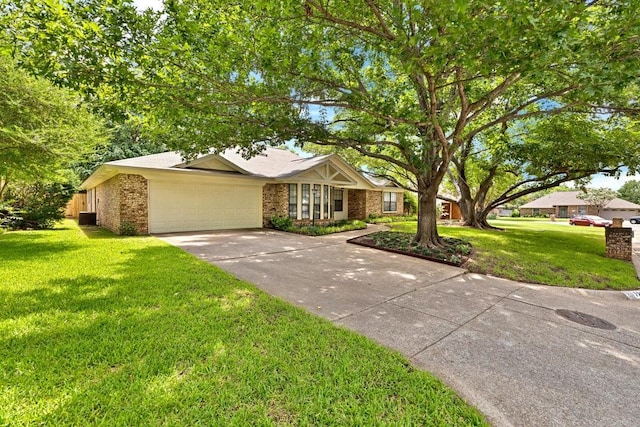 7254 Hialeah Cir W, North Richland Hills, TX 76182 - view of front of property featuring driveway, a front yard, an attached garage, and brick siding