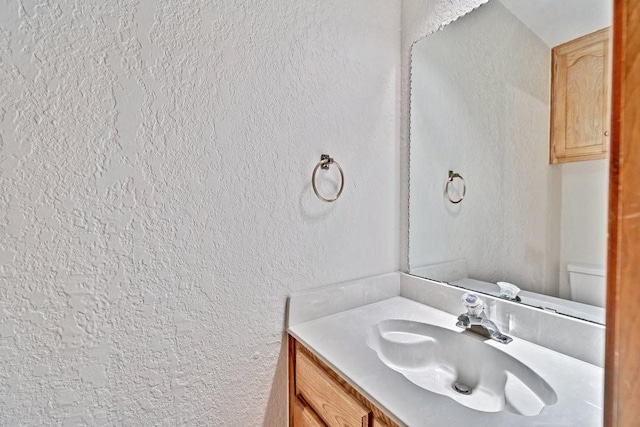 7254 Hialeah Cir W, North Richland Hills, TX 76182 - bathroom with a textured wall and vanity